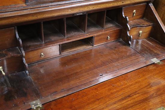 An 18th century German walnut bureau cabinet W.109cm